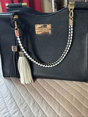 Black Satchel Tote with Braided Black-and-White Handle and Tassel Accents